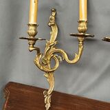Set of three bronze wall sconces.