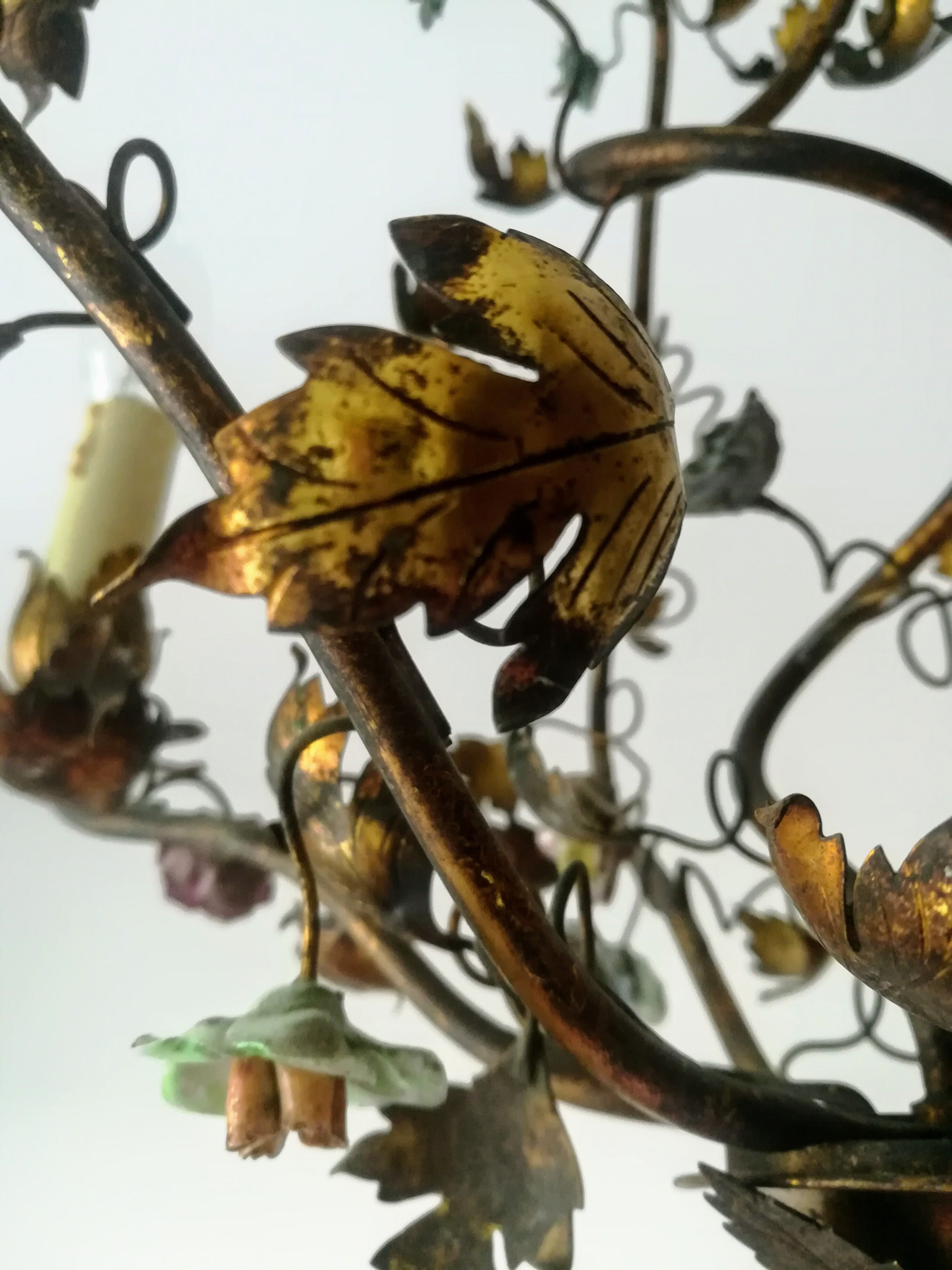 Brass chandelier and porcelain flowers