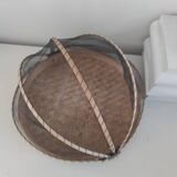 Braided basket with protective mosquito net