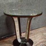 Art Deco guéridon resting on a central base made of stained wood.