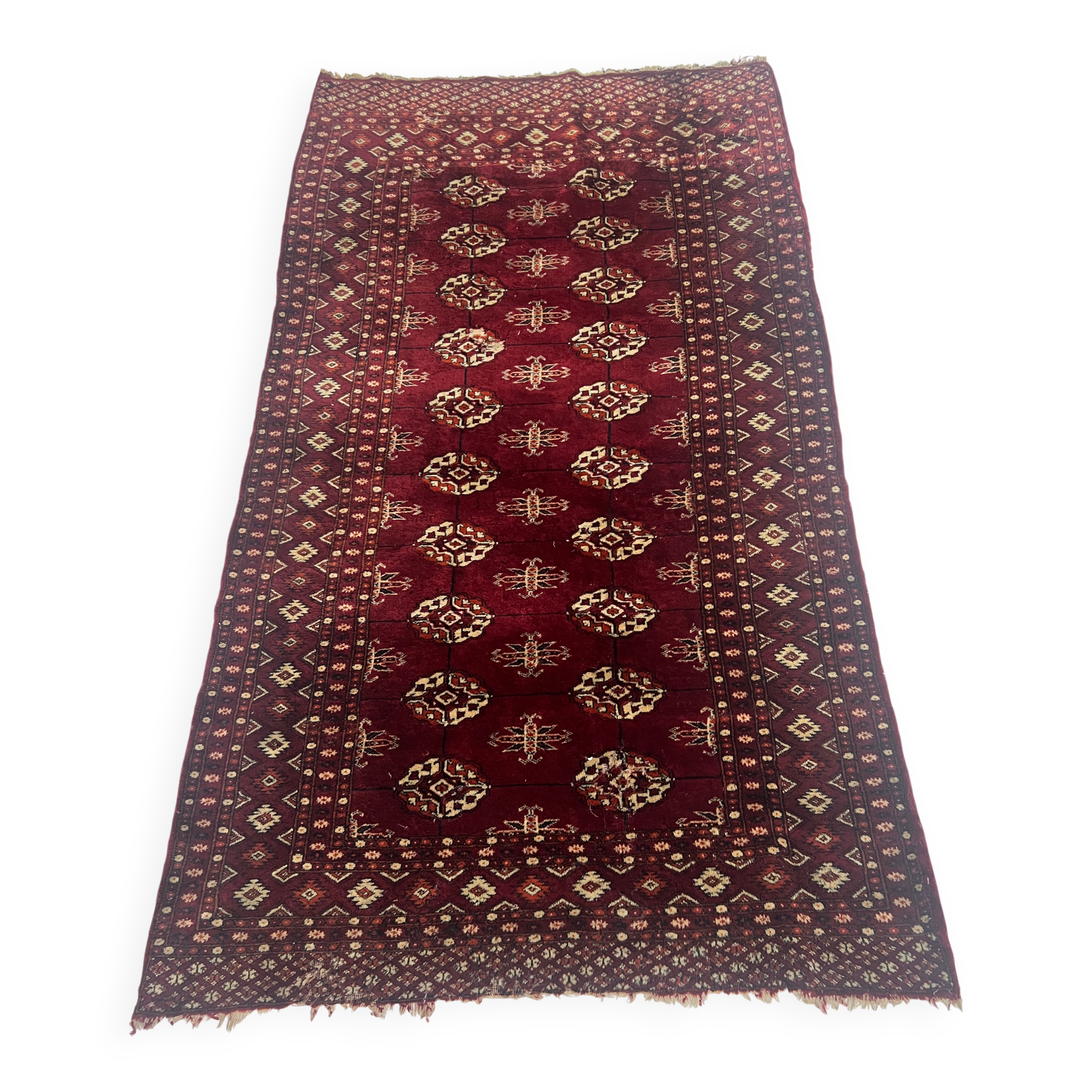 Antique wool rugs with designs on a red background, 20th century.