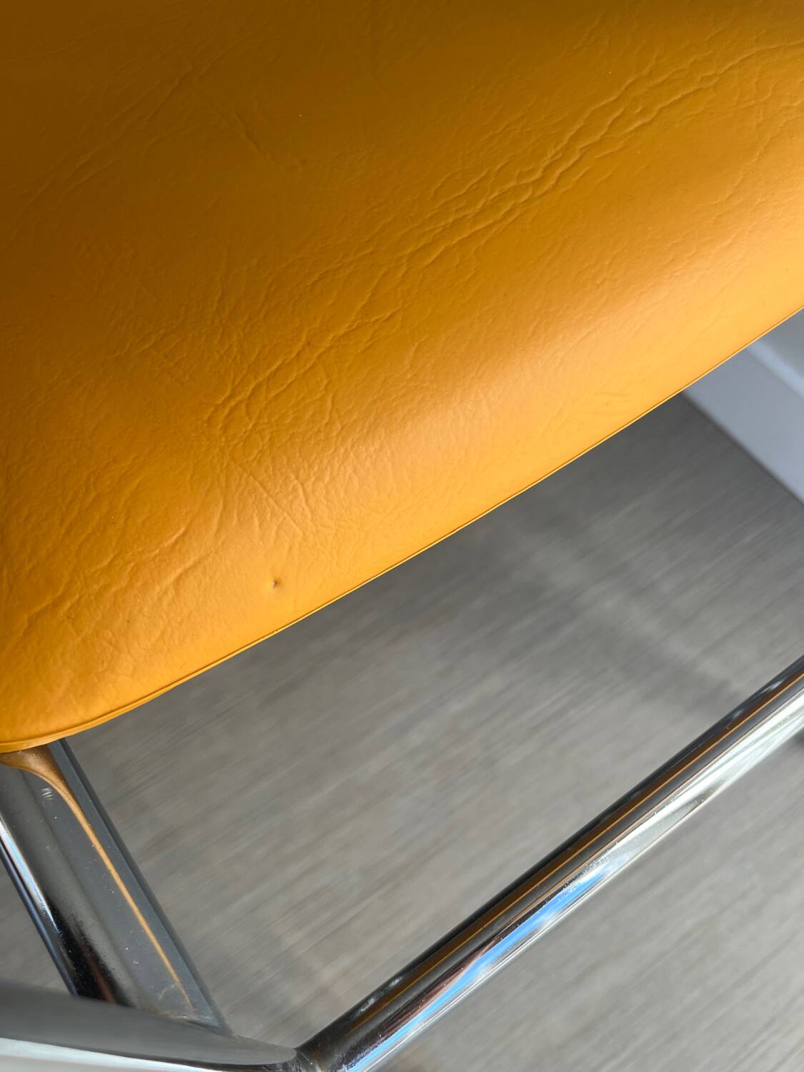 LM vintage chrome and orange/mustard yellow faux leather chairs