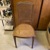 Chair with caned seat and back made of wood