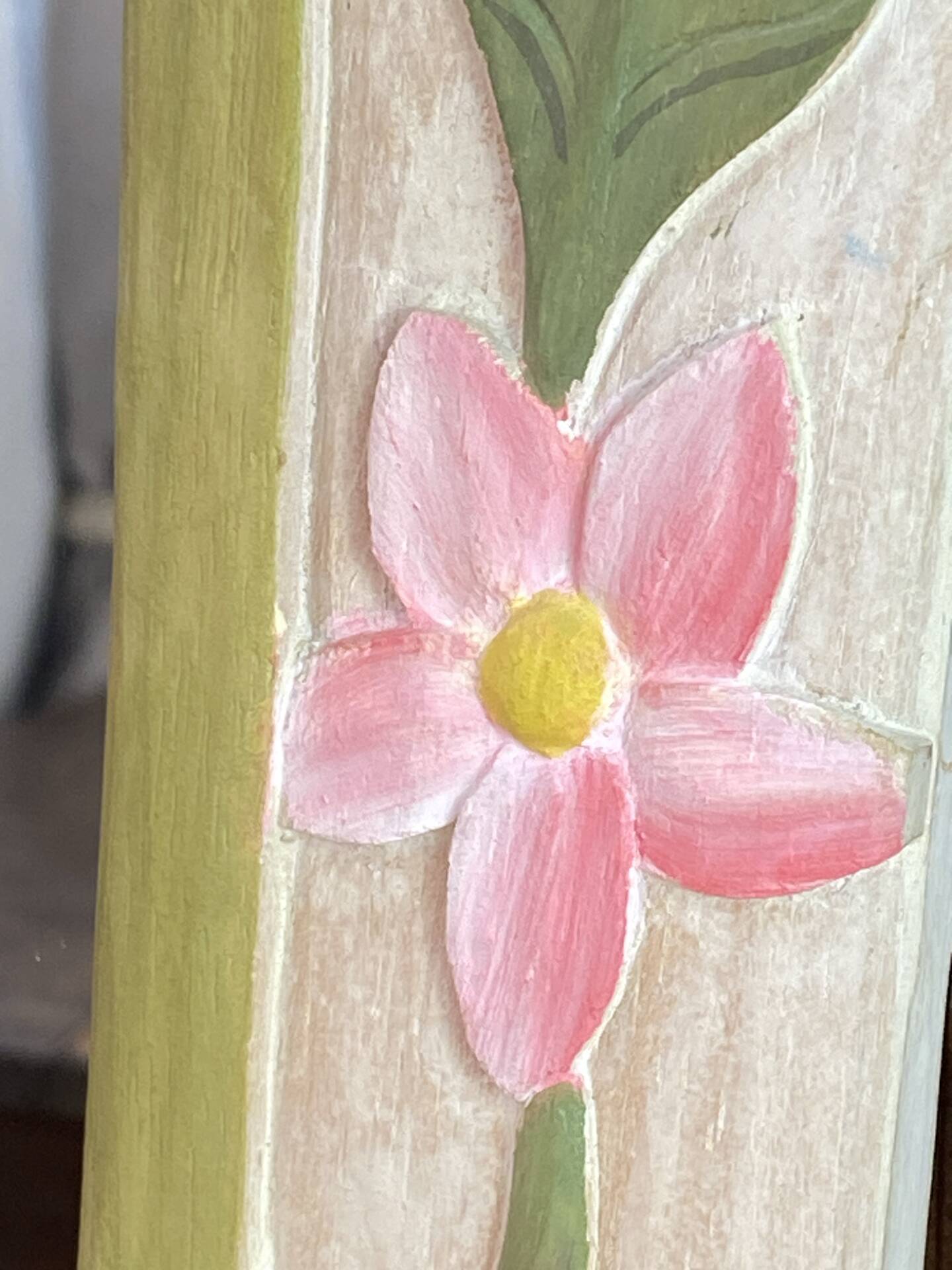 Carved wooden mirror, colourful floral decoration.