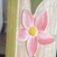 Carved wooden mirror, colourful floral decoration.