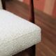 Vintage salon chair in white boucle with a 1950s design.