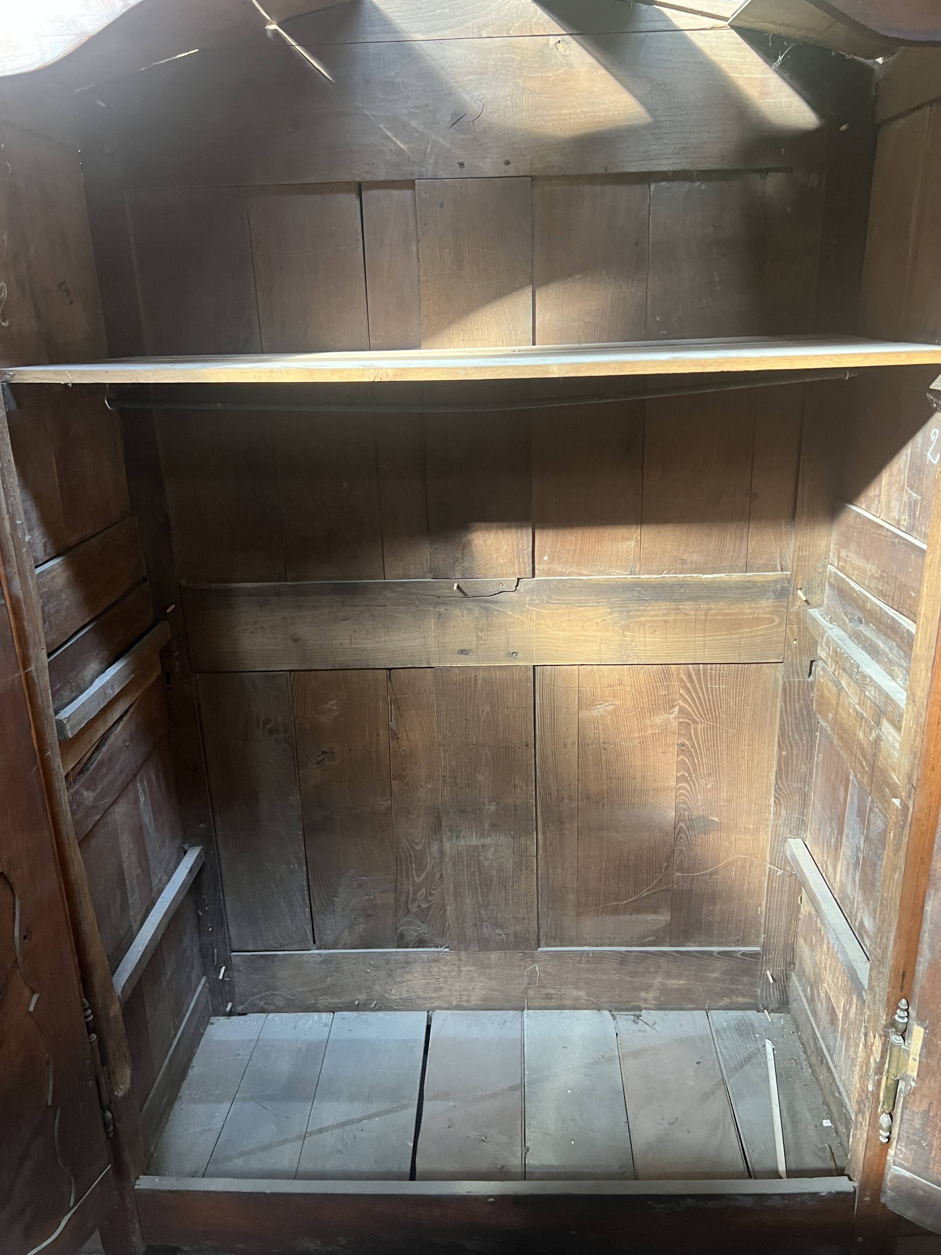 Louis XV armoire with gendarme's hat in solid cherry wood, 18th century