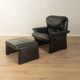 1980s cor armchair and ottoman in black leather
