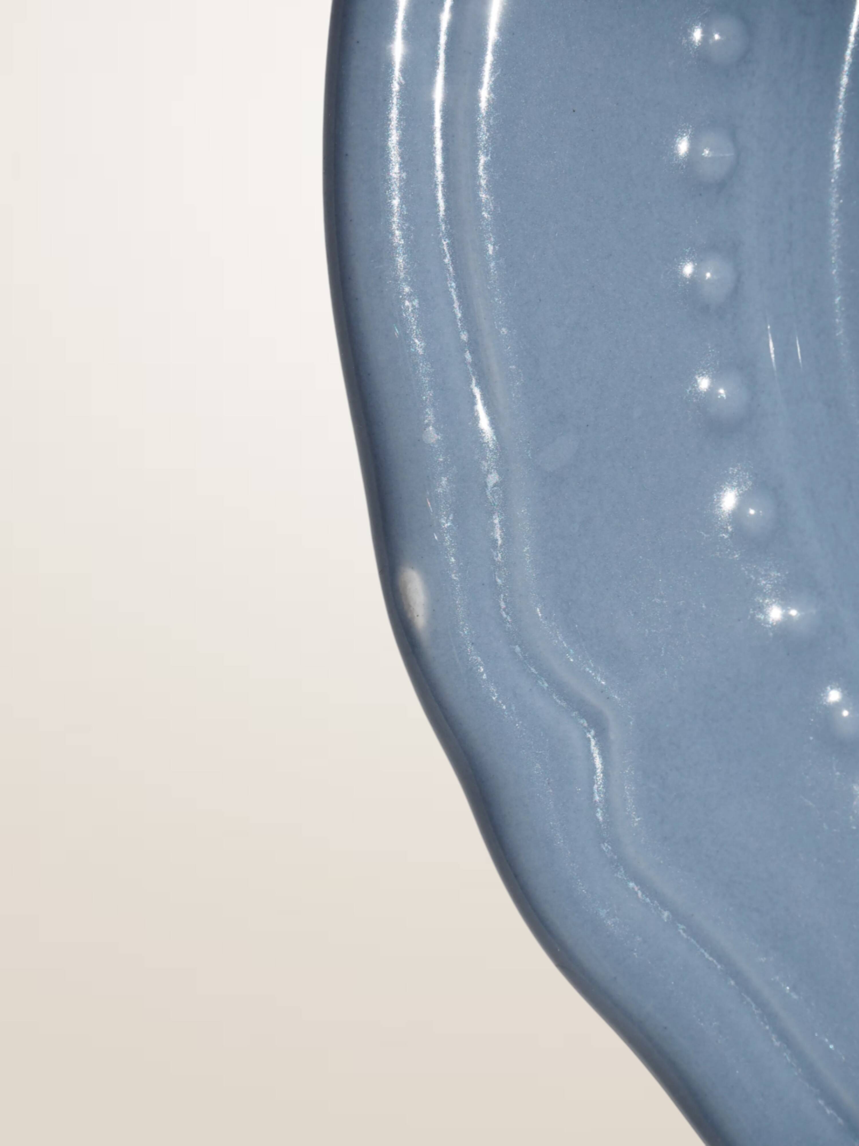 Set of 4 blue ceramic dessert plates.