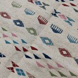 White margoum carpet with multicolored Berber patterns