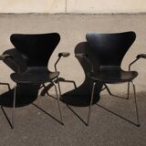Pair of Jacobsen black Series 7 chairs with armrests