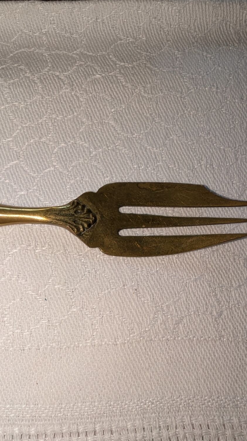 Set of 12 yellow metal cake forks and Bakelite.