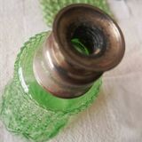 Small green bottle and old metal, single-flower vase