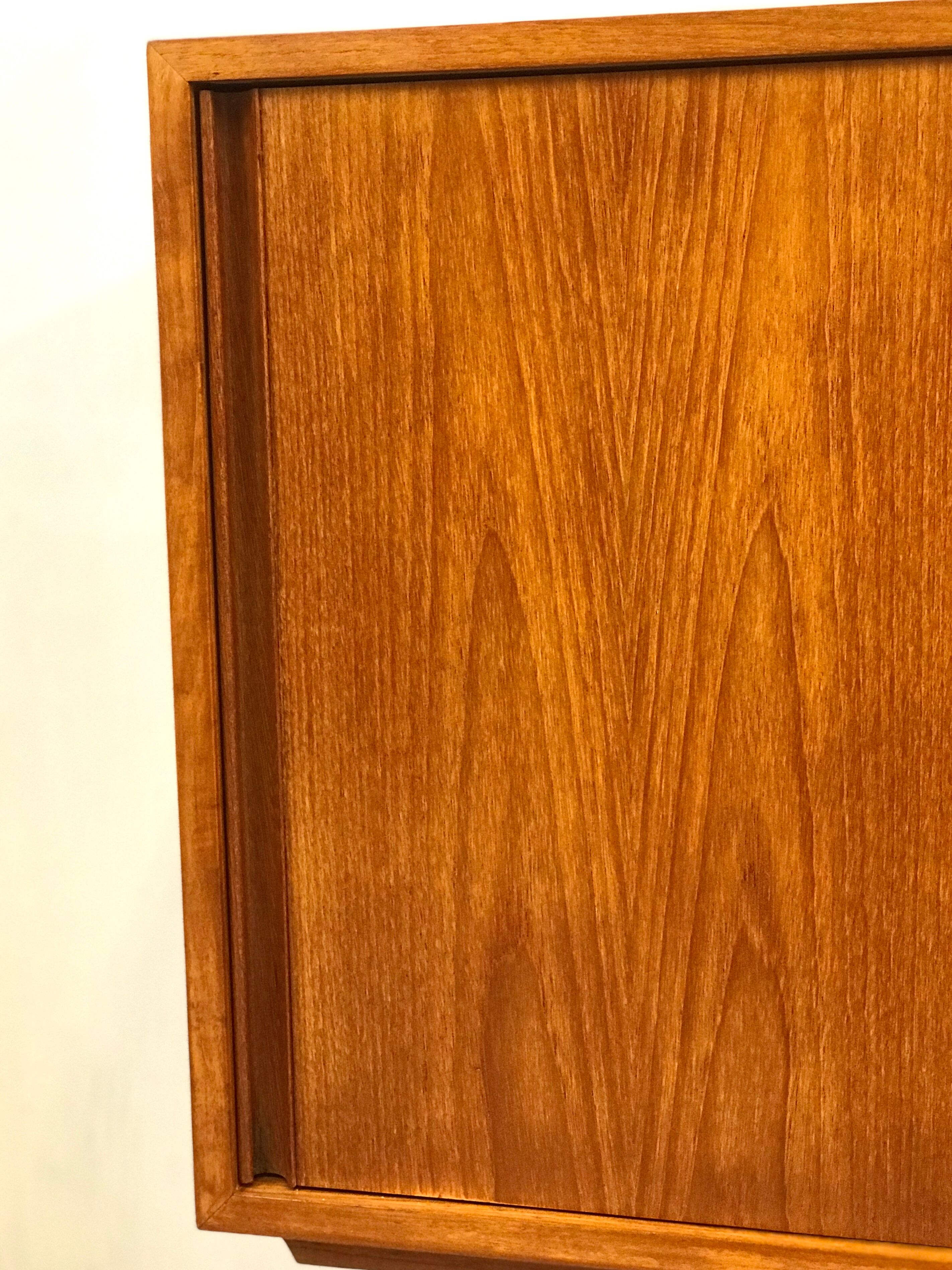 Danish teak sideboard with two sliding doors and 4 central drawers