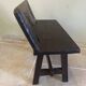Small antique wooden bench with a folding backrest.