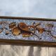 50s Eglomisé glass mirror with musical instrument decor