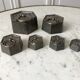 set of old measuring weights early twentieth century