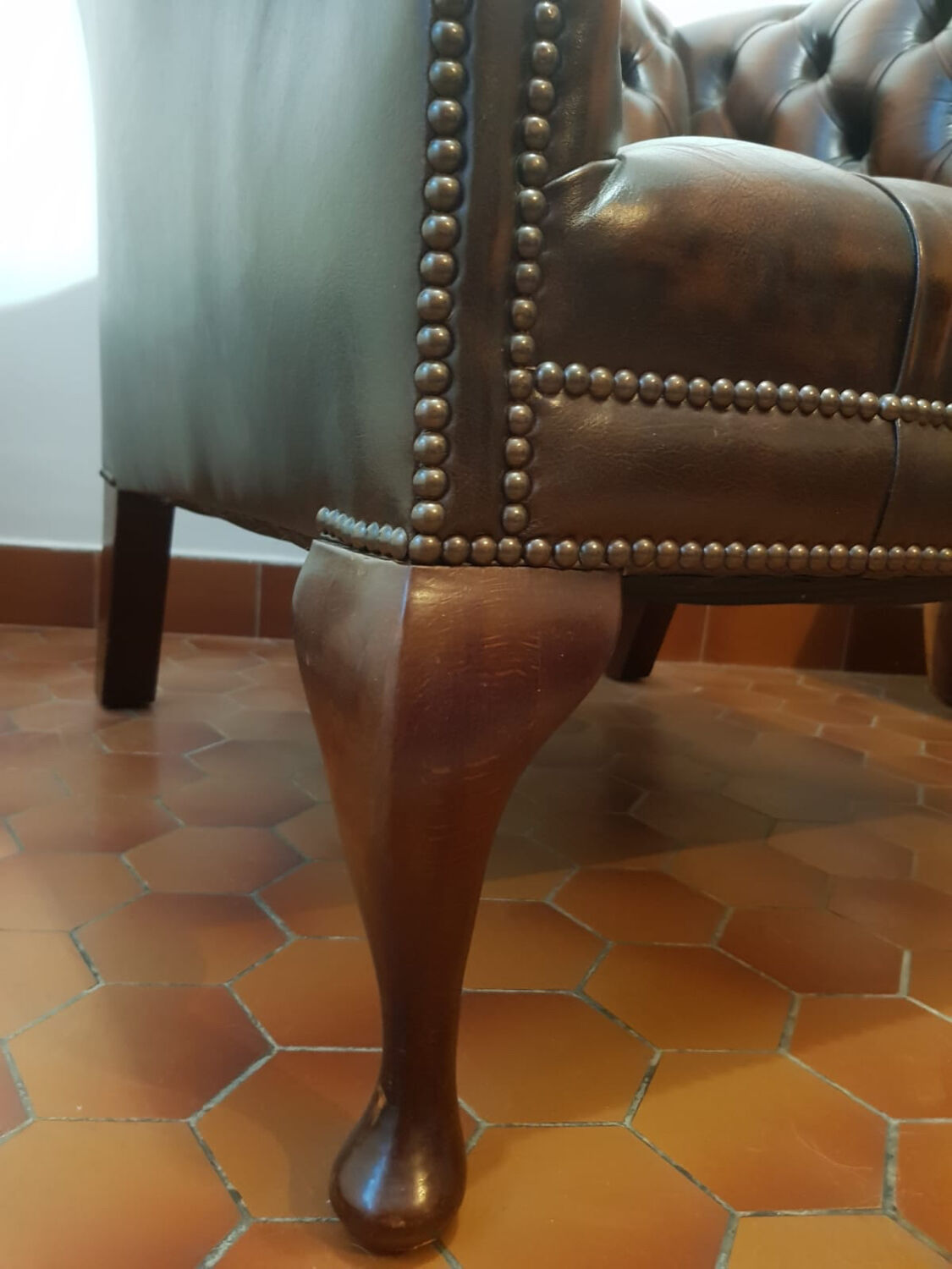 Pair of leather Chesterfield armchairs