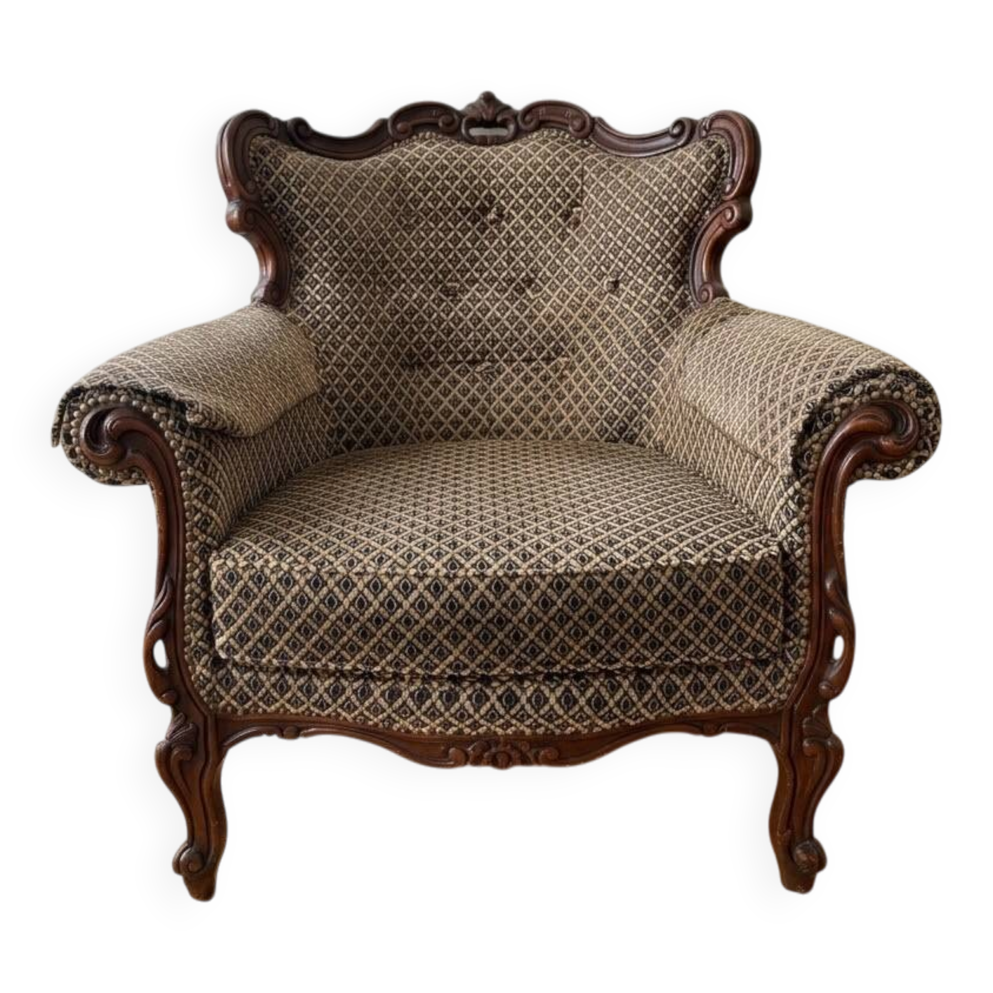 Baroque armchair in carved wood and geometric fabric.