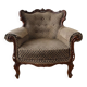 Baroque armchair in carved wood and geometric fabric.