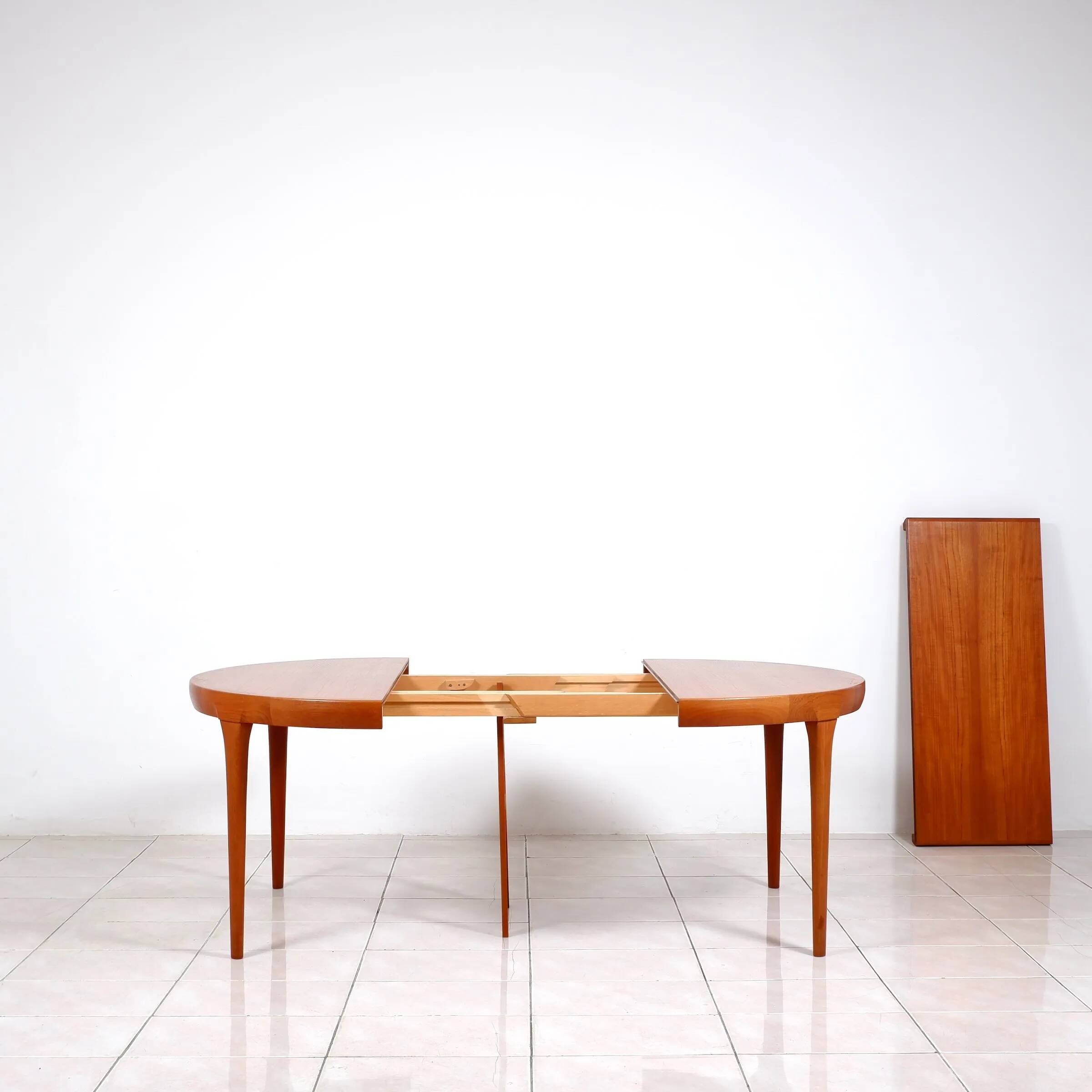 Round dining table in teak by Ib Kofod Larsen for Faarup Mobelfabrik