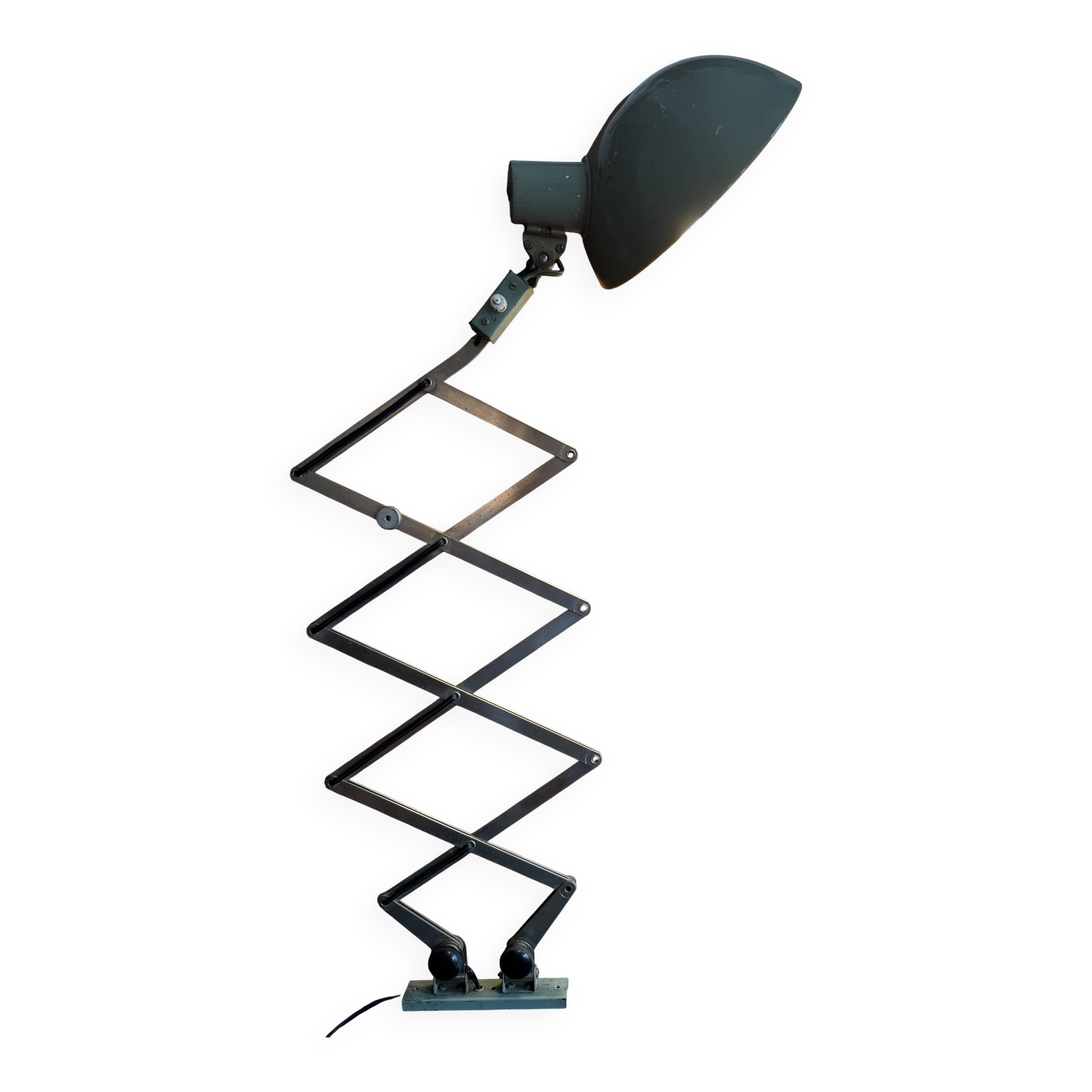 Old extendable accordion lamp in celadon green, workshop spirit.