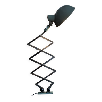 Old extendable accordion lamp in celadon green, workshop spirit.