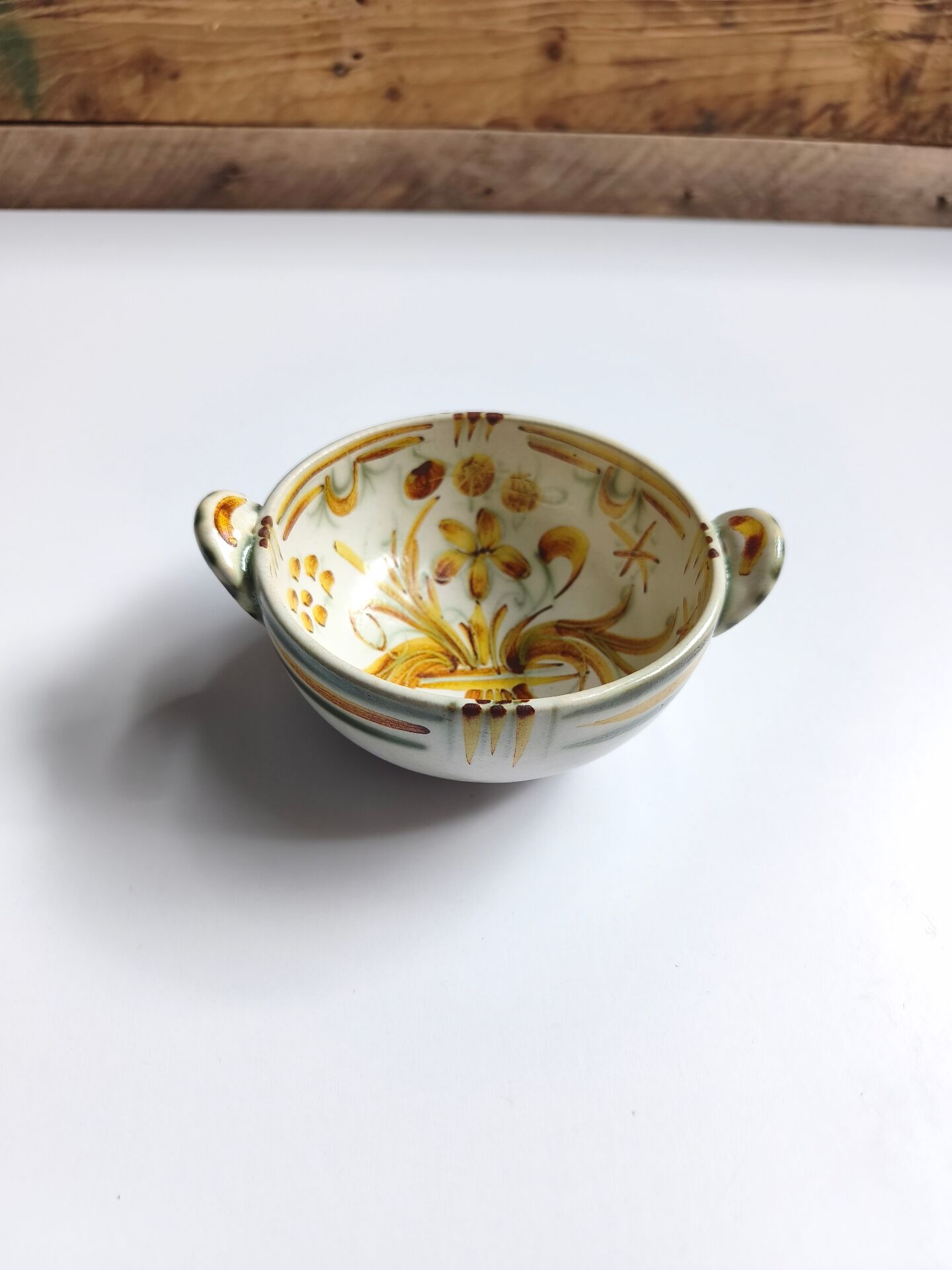 Vintage bowl signed Keraluc Quimper in yellow and green.