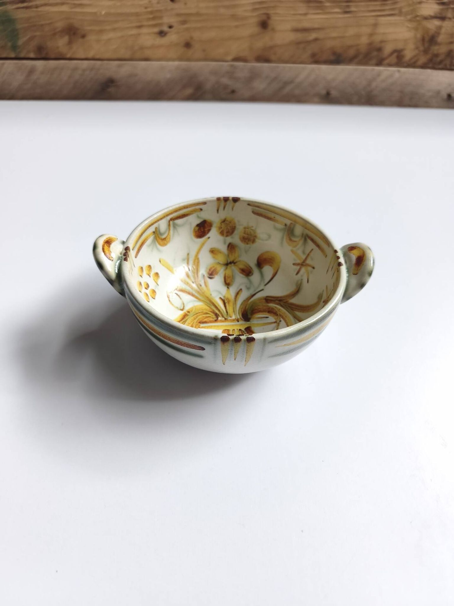 Vintage bowl signed Keraluc Quimper in yellow and green.