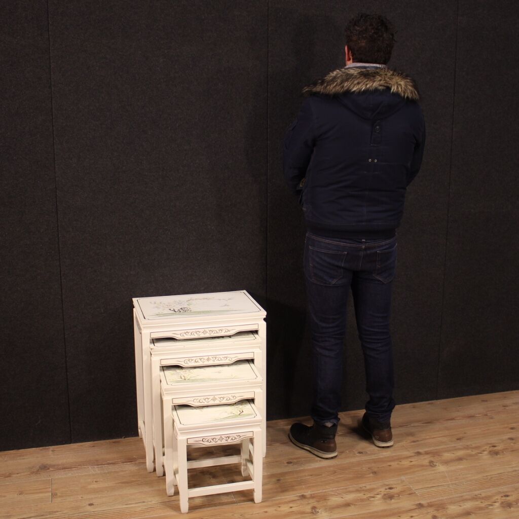 Four lacquered and painted living room coffee tables