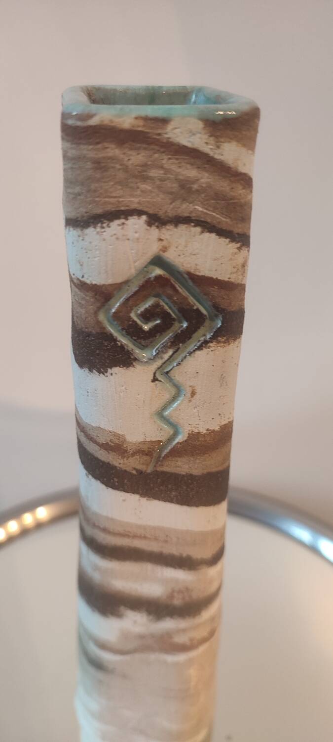 Turned stoneware vase signed with relief decoration.
