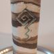 Turned stoneware vase signed with relief decoration.