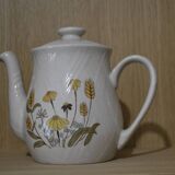 Teapot with yellow flowers
