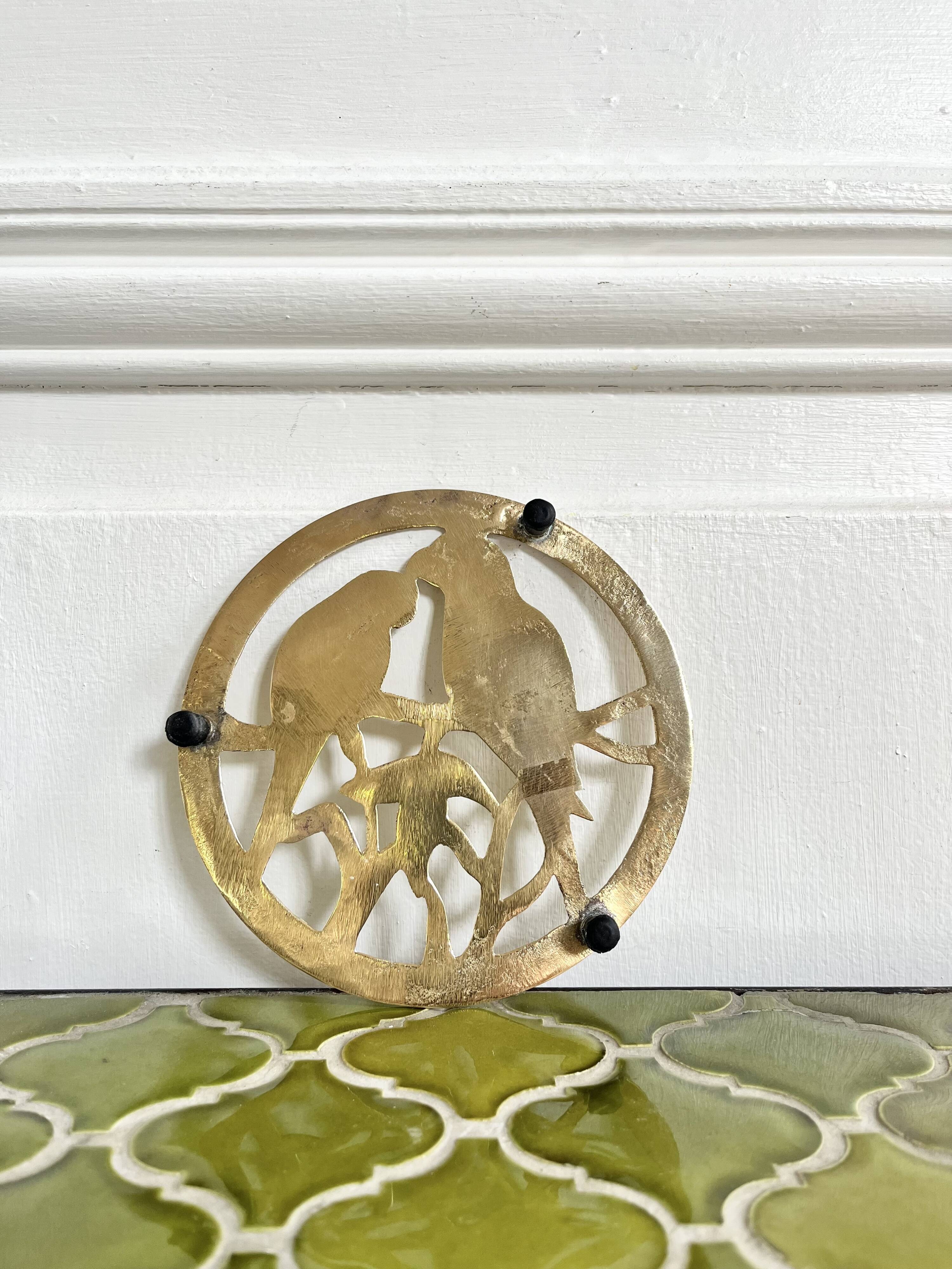 Small brass trivet with parrots or inseparable birds