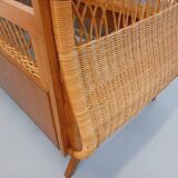 Vintage oak and rattan baby cot from the 1960s.