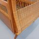 Vintage oak and rattan baby cot from the 1960s.