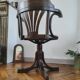 Vintage swivel office chair with curved wood and caning (Thonet style)