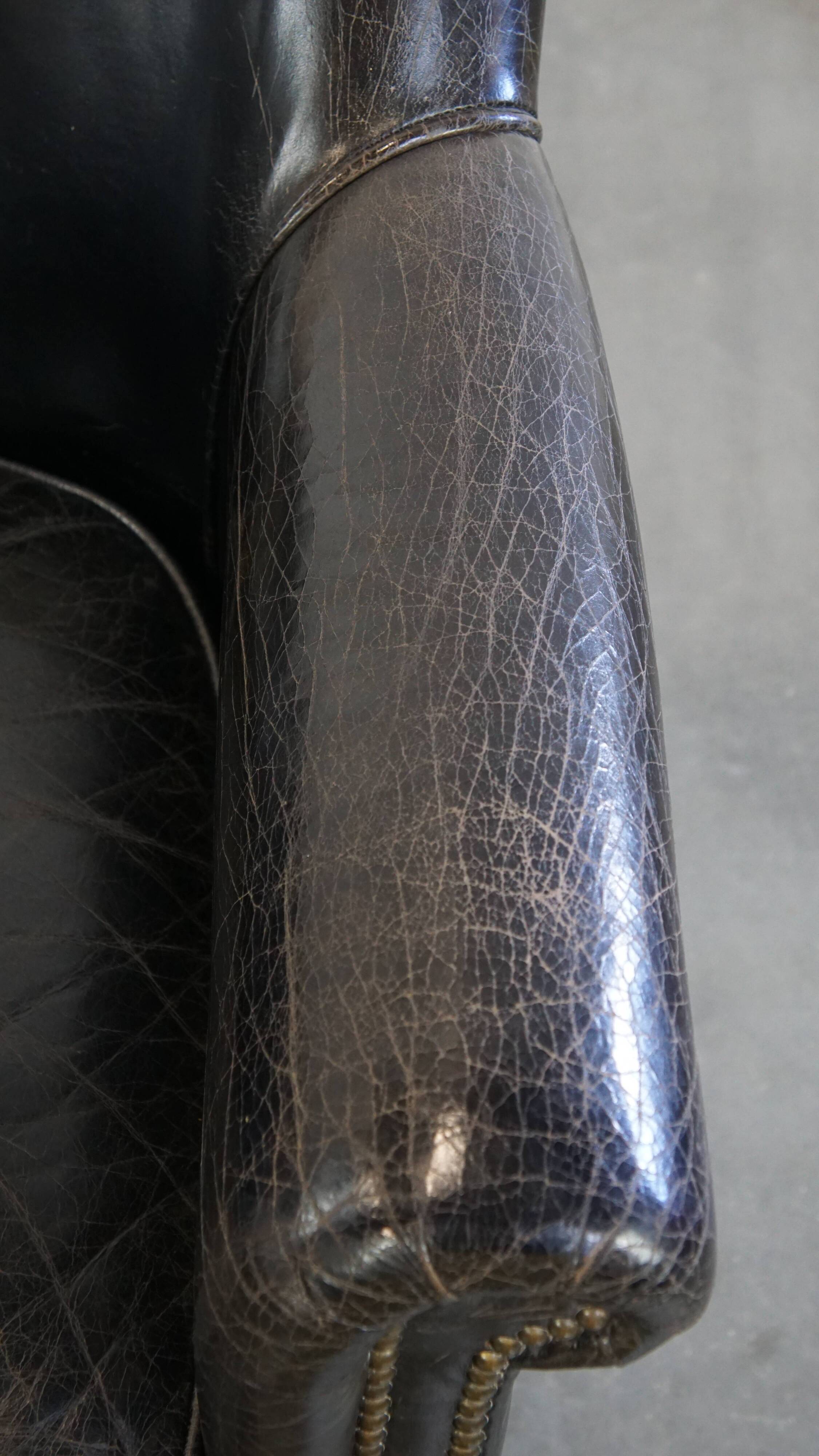 Black grained cowhide leather armchair