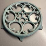Old cast iron trivety turquoise