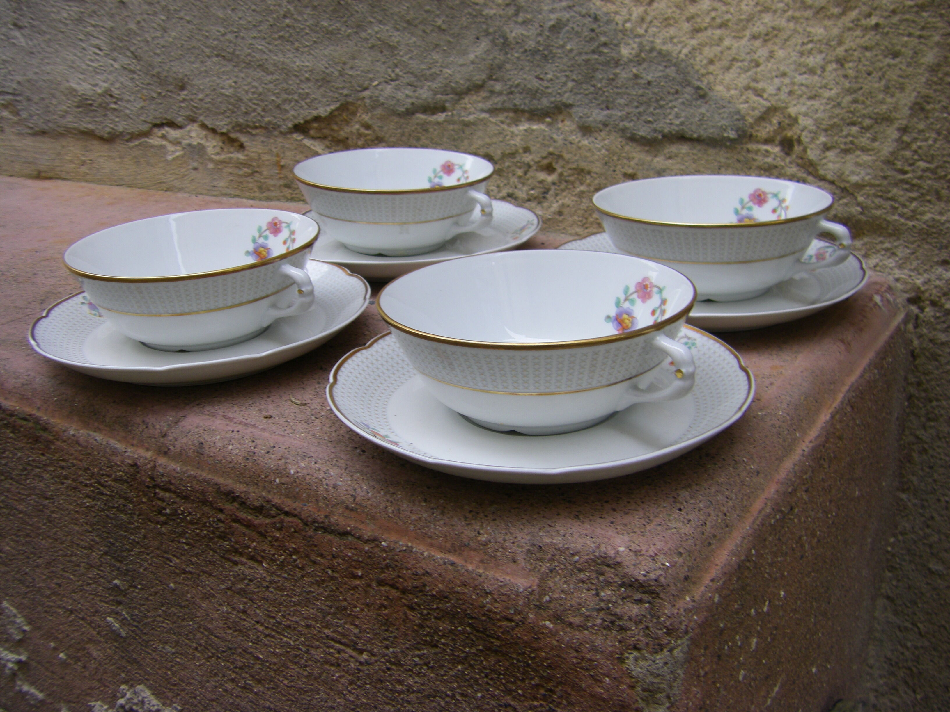 Four porcelain tea cups