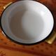 Enamelled dish with handles