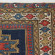 Handwoven blue ground persian rug with bird-like figures