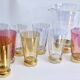 Orangeade set in colored glass