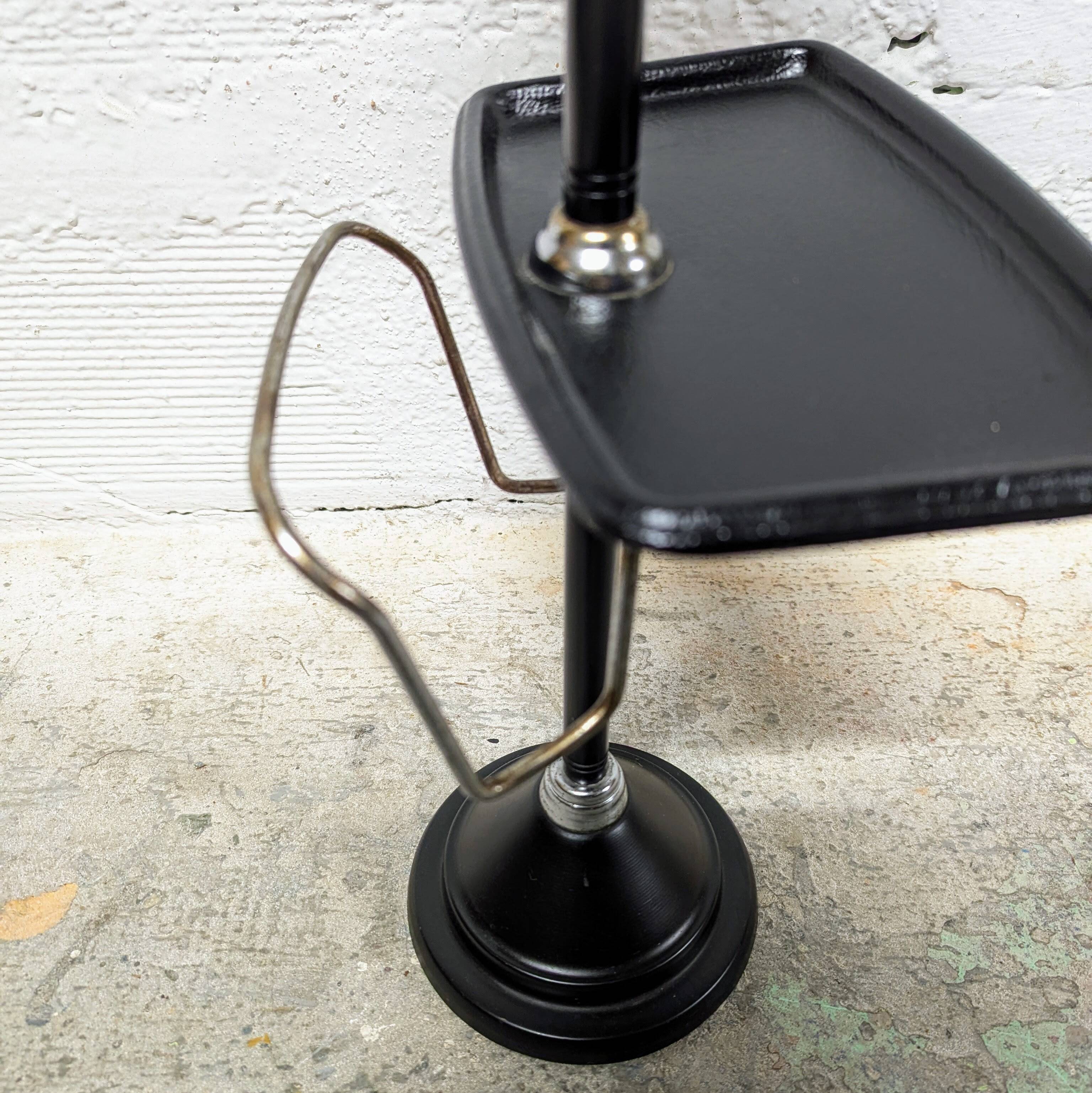 Standing ashtray with magazine rack