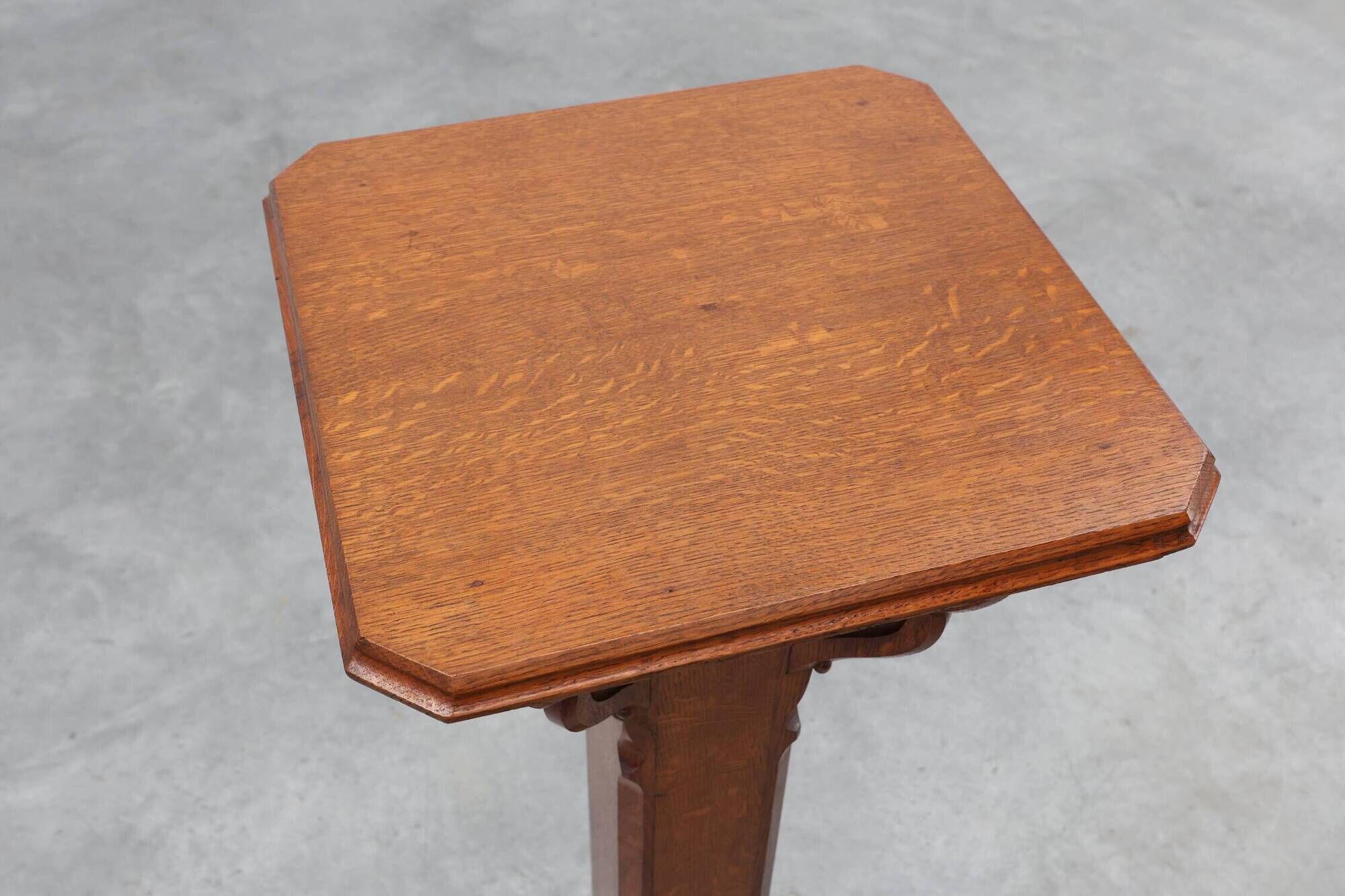 Art Deco oak pedestal with pierced brackets and cross base, Belgium 1920s