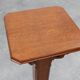 Art Deco oak pedestal with pierced brackets and cross base, Belgium 1920s