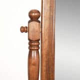 Large psychic mirror on legs with pivoting oval frame.