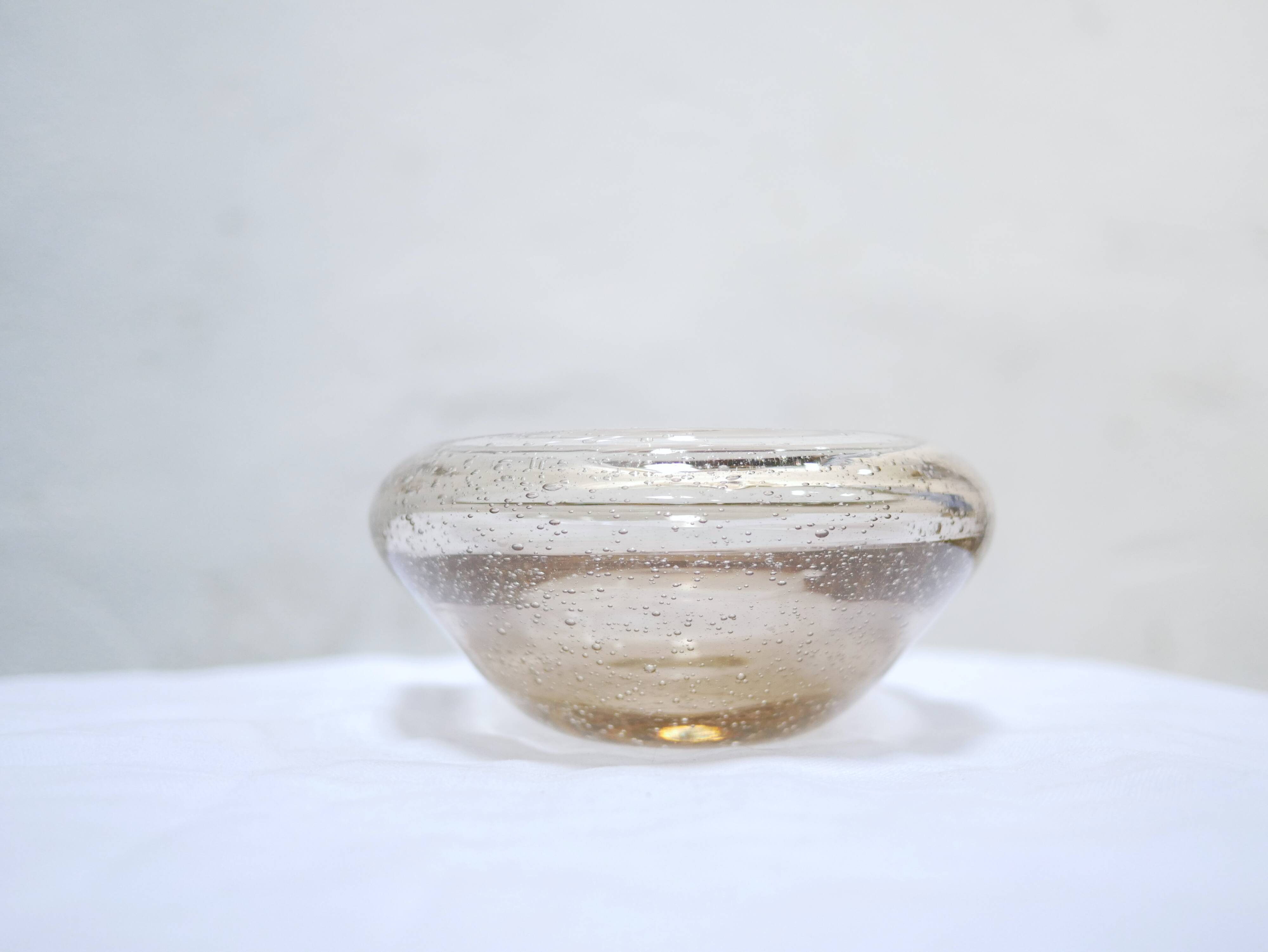 Empty vintage glass pocket blown by the glassworks of Biot