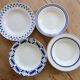 4 mismatched vintage deep plates in blue and white porcelain