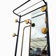 1960s modernist wardrobe. Gold lacquered metal.